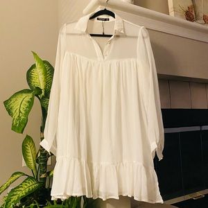 Very cute white summer dress. Runs a bit big!
